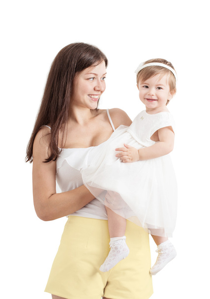 Мама держит милую маленькую девочку, изолированную на белом
 - Фото, изображение