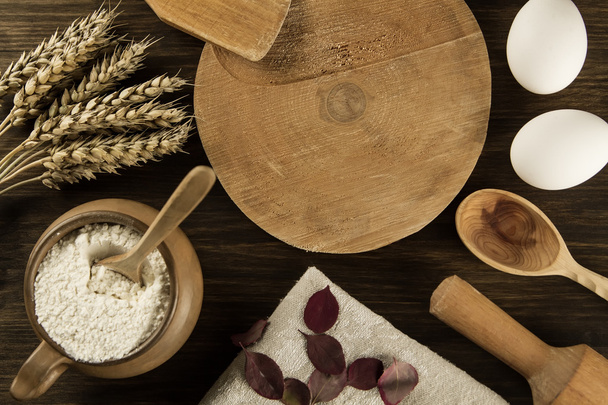 pot of flour, wheat ears, kitchen utensils on wooden background. homemade, menu, recipe, mock up - Zdjęcie, obraz
