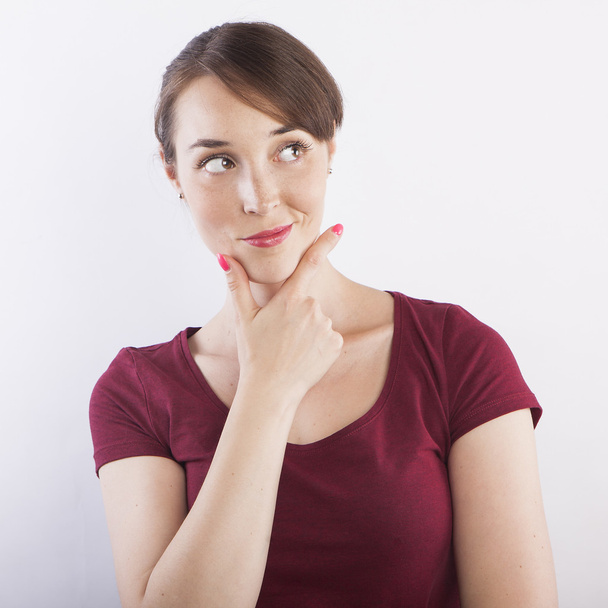 woman thinking with hand on chin - Photo, Image