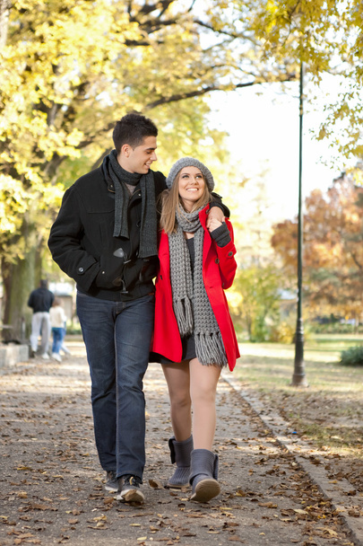 Young couple walking in park - Photo, Image
