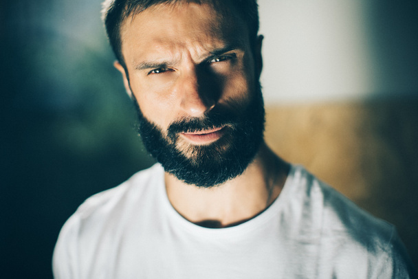 Portrait of a bearded man wearing white tshirt - Фото, изображение