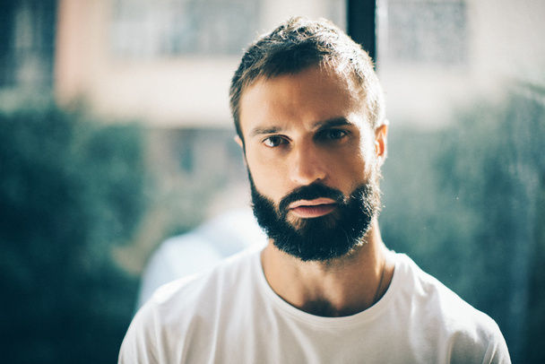 Mock up of a serious bearded man - 写真・画像