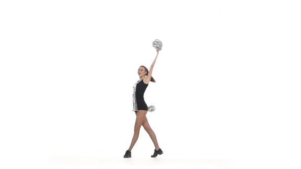 Young cheerleader with pom-poms smiling at camera, smiling at the camera - Video, Çekim