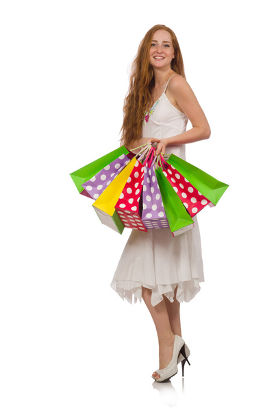 Woman with shopping bags isolated on white - 写真・画像