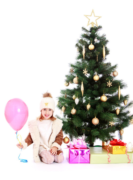 little girl at the Christmas tree - Фото, изображение