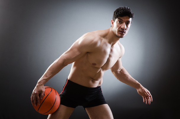 Muscular basketball in sports concept - Foto, imagen