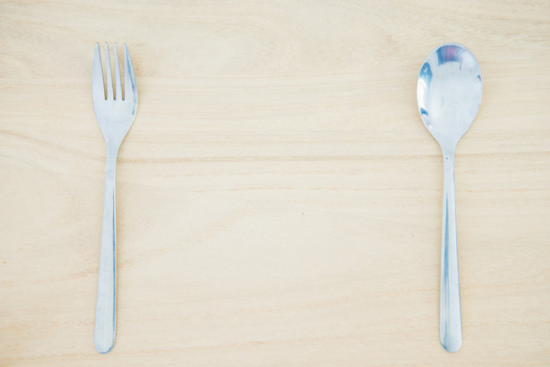 Fork and spoon on wood texture background - Photo, Image