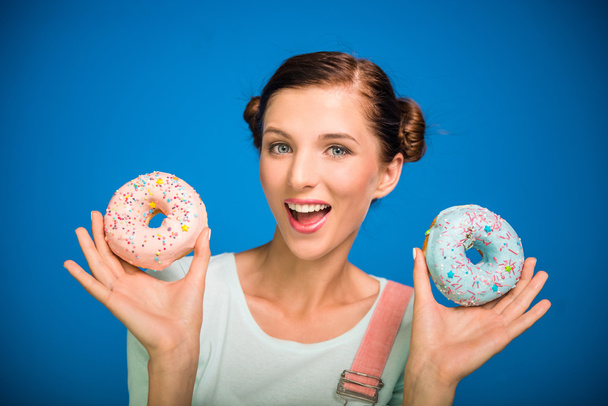 Woman with donuts. - Foto, imagen