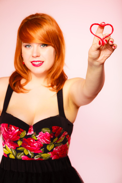 Gorgeous young woman holding candy heart. - Fotografie, Obrázek