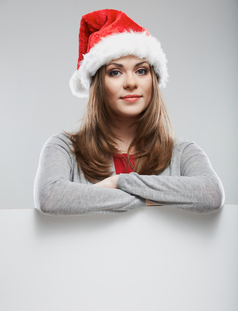 Woman in Santa hat with board - Fotoğraf, Görsel