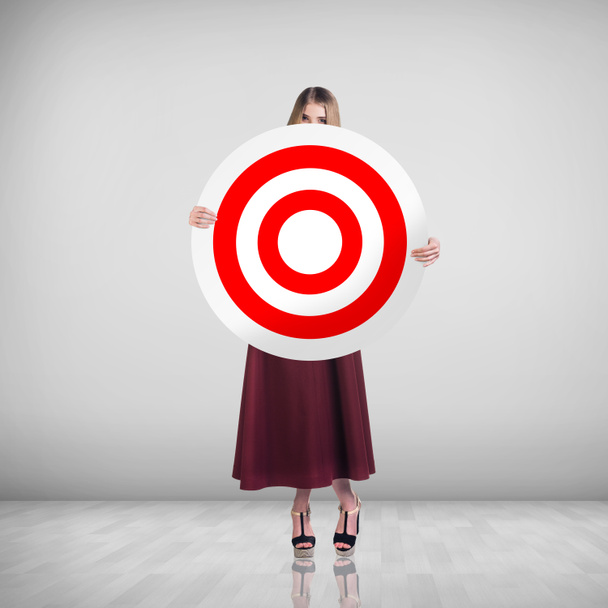 Business woman holding big target - Photo, Image