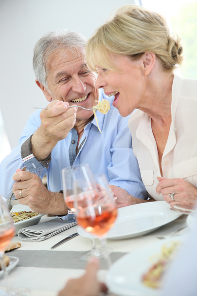 Senior couple sharing pasta - Φωτογραφία, εικόνα