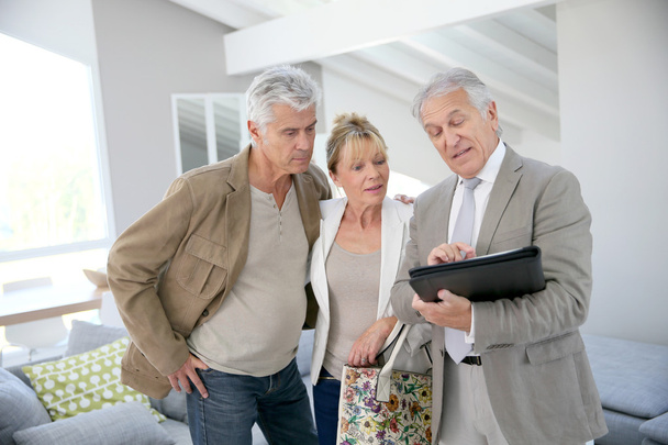 Senior couple with real-estate agent - Photo, Image