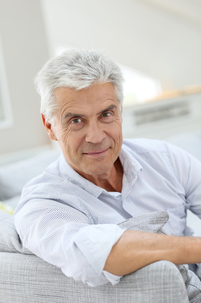 elderly man relaxing in sofa at home - Photo, Image