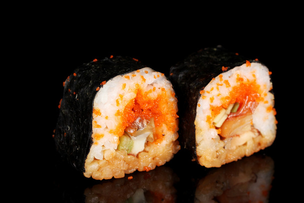 Delicious sushi on black background - Foto, Imagen