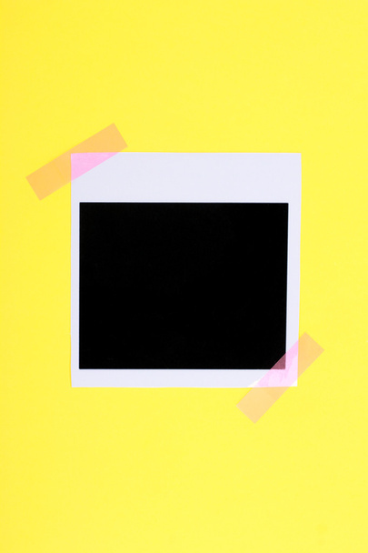 Photo paper glued on yellow paper isolated on white - Valokuva, kuva