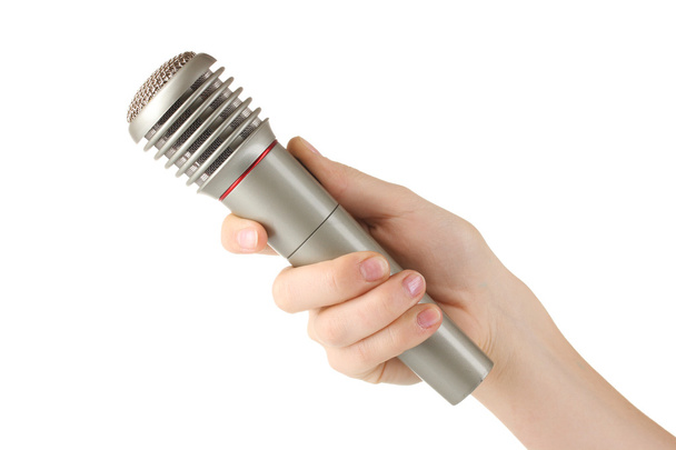 Shiny grey iron microphone in hand isolated on white - Foto, Bild