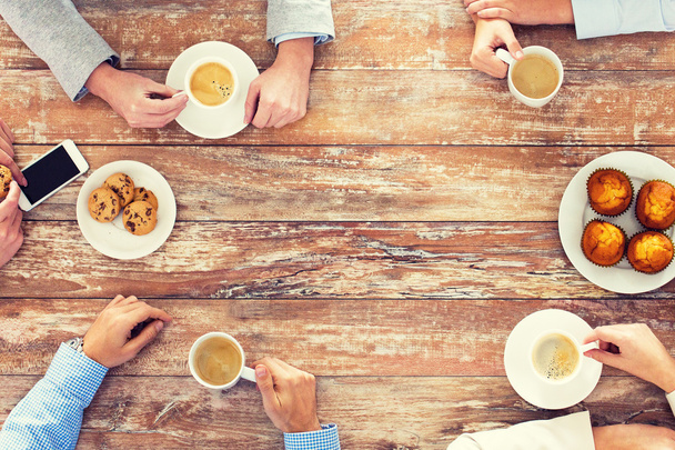 close up of business team drinking coffee on lunch - Foto, Imagem