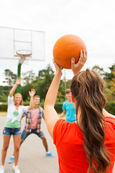 group of happy teenagers playing basketball - Fotoğraf, Görsel