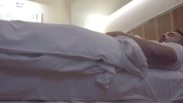 Woman throws off the bed with a man - Footage, Video