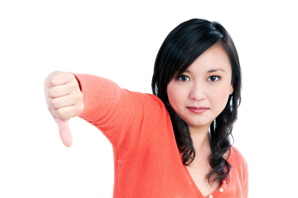 Раздражённая женщина показывает пальцами вниз жест
 - Фото, изображение