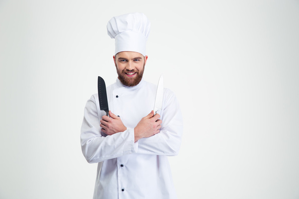 Smiling chef cook holding two knifes - Fotoğraf, Görsel