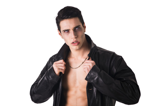 Young Vampire Man in an Open Black Leather Jacket, Showing his Chest and Abs - Fotó, kép