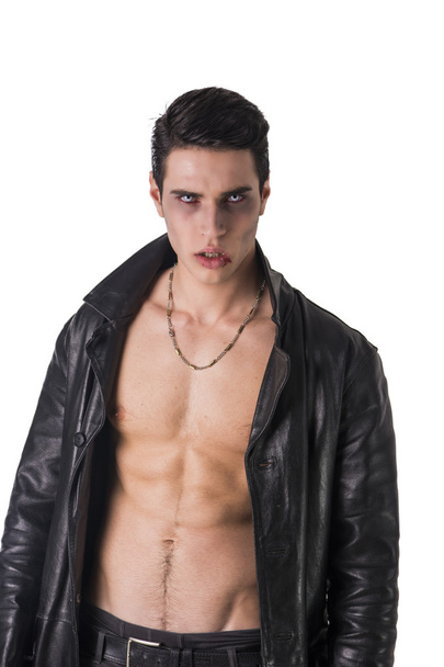Young Vampire Man in an Open Black Leather Jacket, Showing his Chest and Abs - Photo, image
