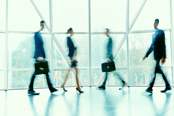 Blurred figures of hurrying employees - Photo, Image