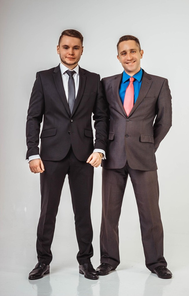 Two business men standing like a team,  isolated on white background - Fotoğraf, Görsel