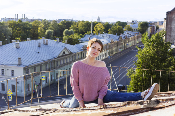 Russian girl walking on the roof - 写真・画像
