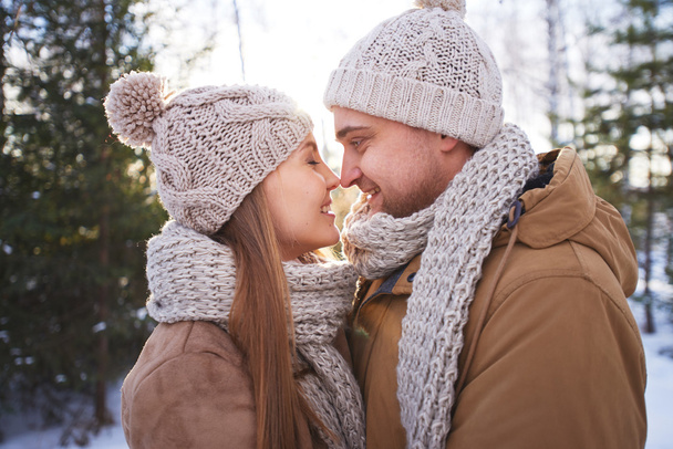Young amorous couple in winter - Фото, зображення