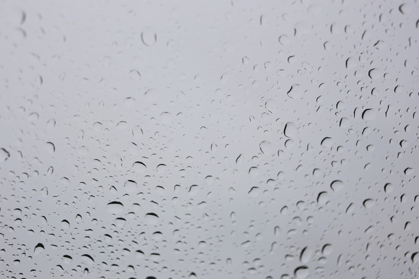 Dešťové kapky na skleněném pozadí. - Fotografie, Obrázek