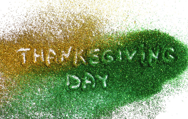Words Thanksgiving Day of golden and green glitter sparkle on white background - Photo, Image
