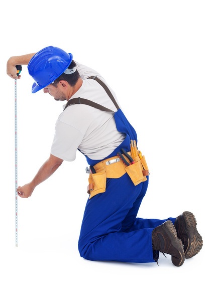 Práctico hombre o trabajador de la construcción de medición
 - Foto, Imagen
