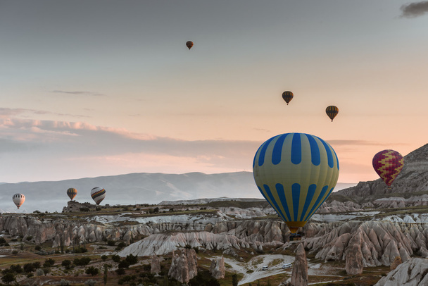 Hot air balloon flying over Cappadocia, Turkey - 写真・画像