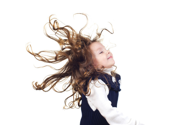 Little girl with flying hair - 写真・画像
