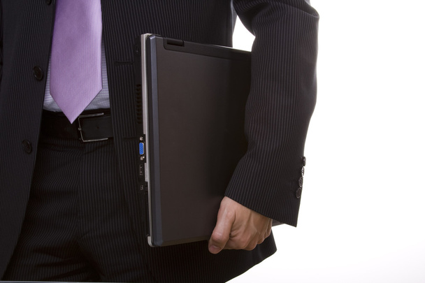 Businessman holding a laptop - Foto, imagen