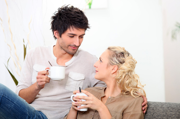 Couple having a cup of coffee together in the morning - Fotoğraf, Görsel
