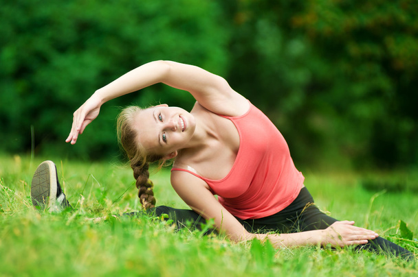 Young woman doing stretching exercise - Photo, image