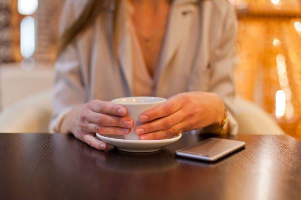 Woman drink coffe in cafe - Фото, изображение