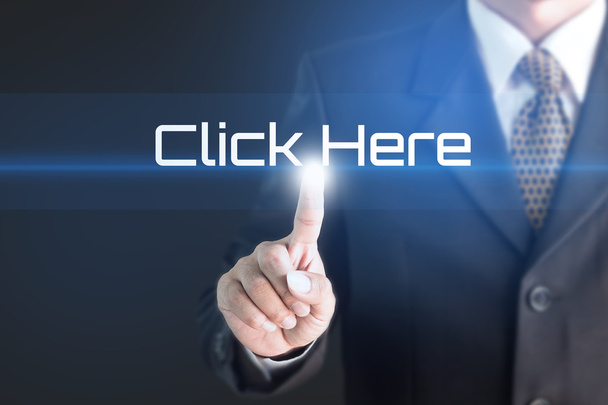 Business man pointing at CLICK HERE word for business background concept - Photo, Image