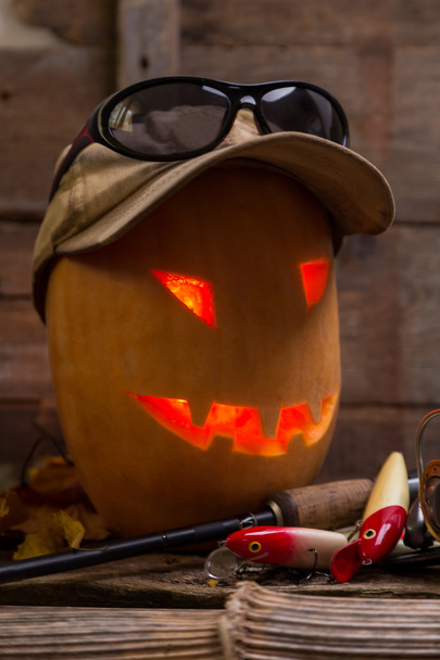 halloween pumpkin head with fishing tackles - Foto, imagen