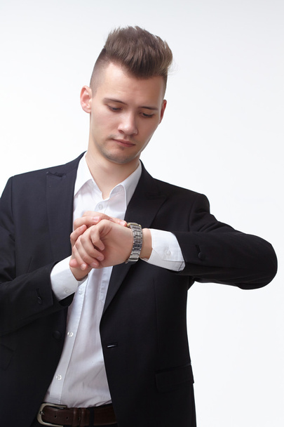 Businessman looking at watch - Foto, Imagen