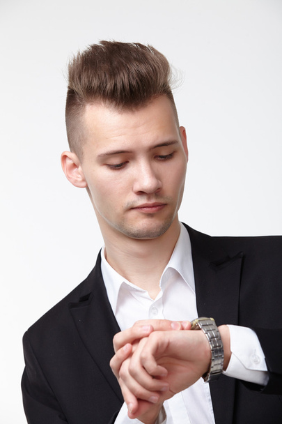 Businessman looking at watch - Photo, image