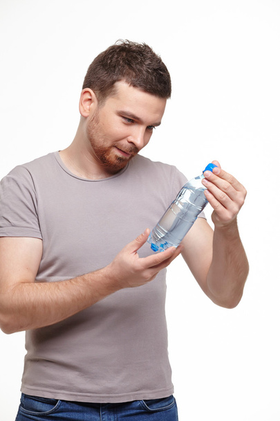 Man with bottle of water - Fotó, kép