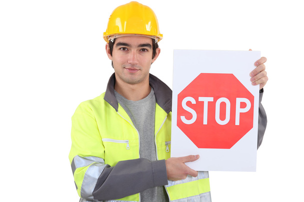 Worker with stop sign - Foto, Imagen
