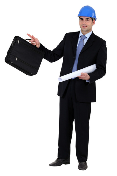 Construction businessman holding a blueprint and a briefcase - Foto, afbeelding