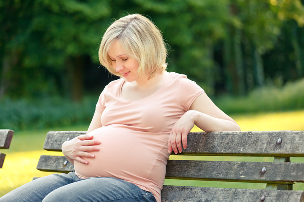 Pregnant woman in the park - Photo, image