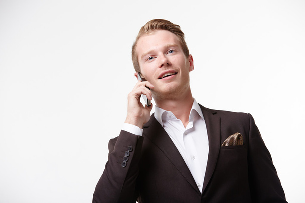 Handsome businessman with mobile - Foto, Bild